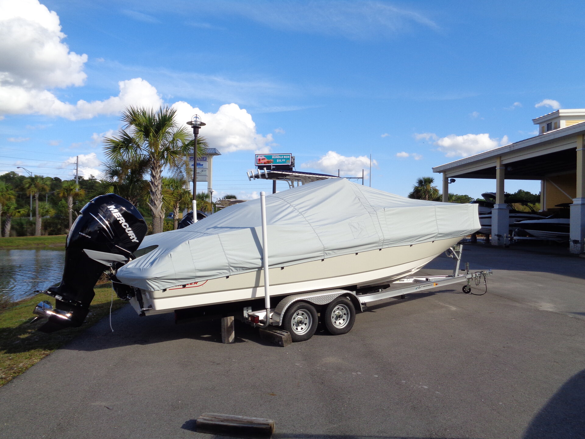 Custom-fit cover installed on Boston Whaler 240 Dauntless Outboard