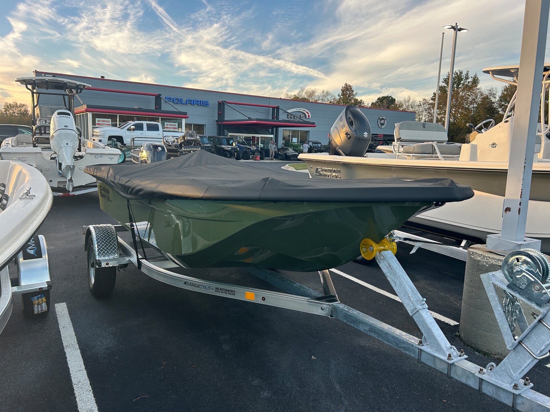 Custom-fit cover installed on Carolina Skiff E16 JVX TH CC Outboard
