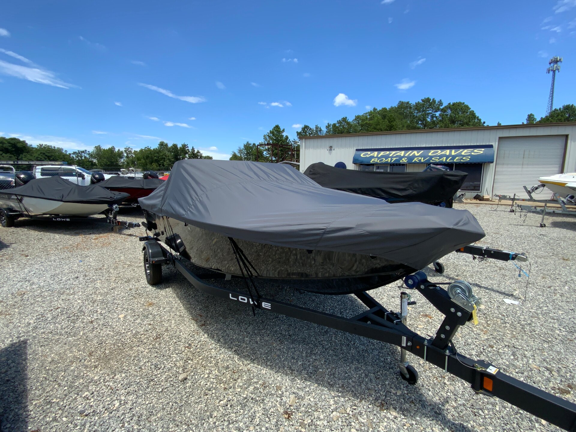 Custom-fit cover installed on Lowe Fishing Machine 1775 WT Outboard