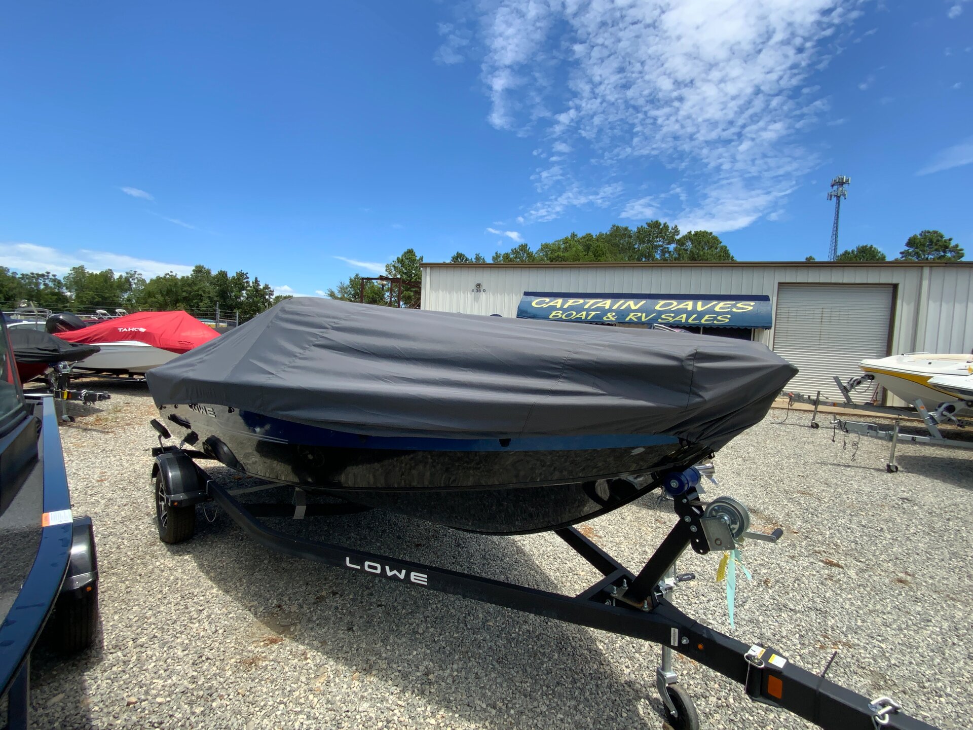 Custom-fit cover installed on Lowe Fishing Machine 1800 SC Outboard