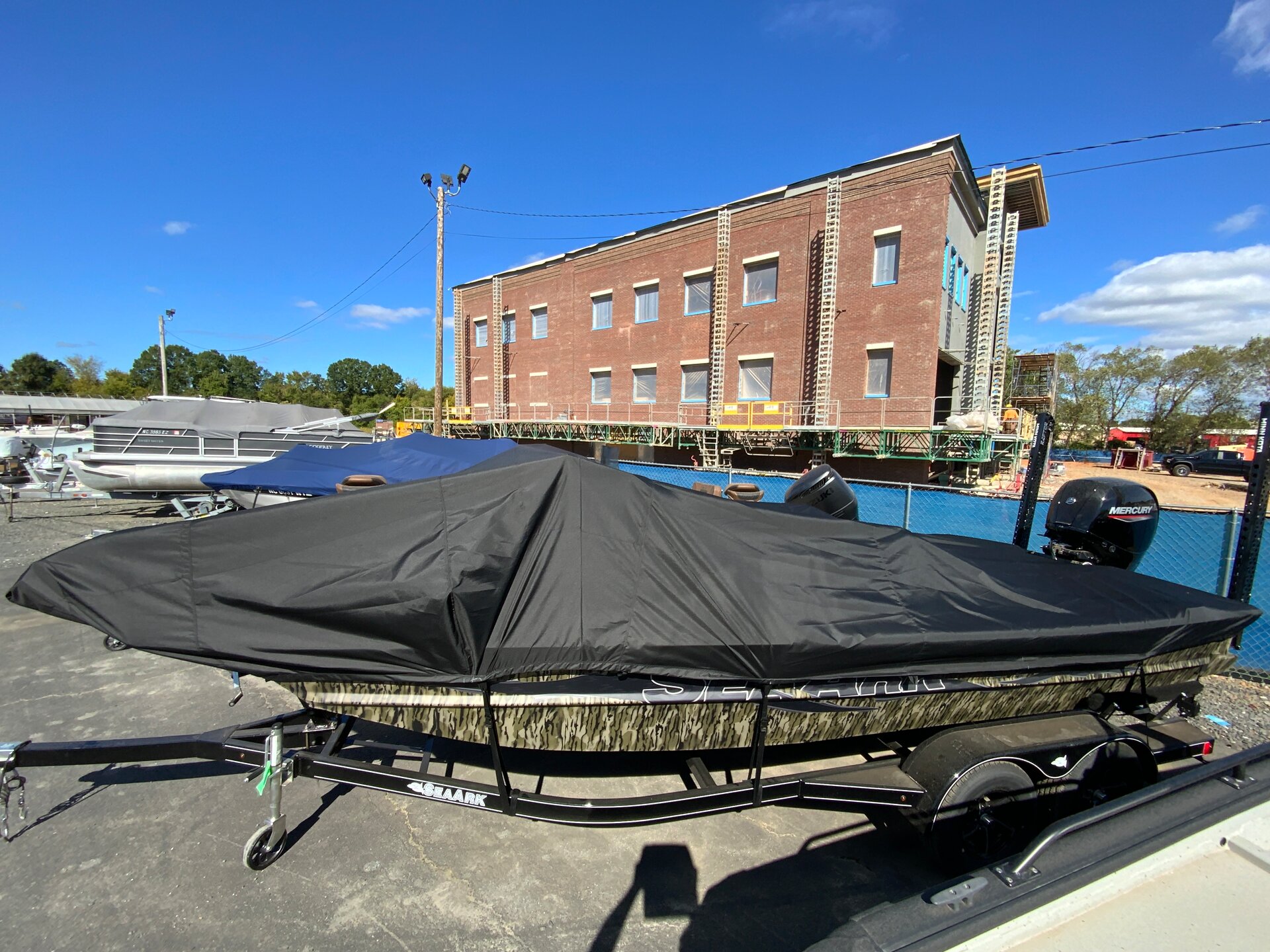Custom-fit cover installed on Sea ARK Flat KAT Outboard