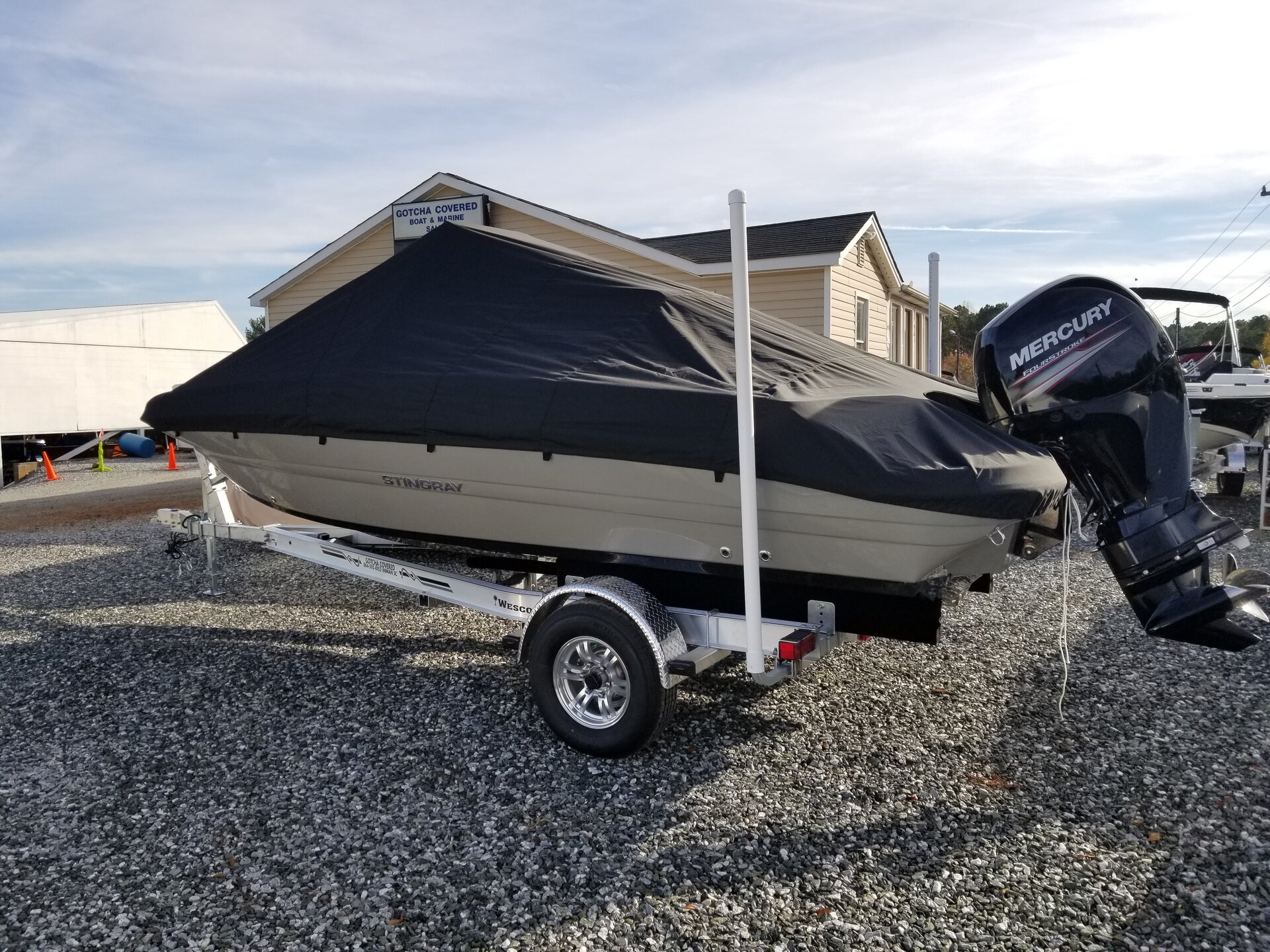 Custom-fit cover installed on Stingray 206CC Deck Boat Outboard