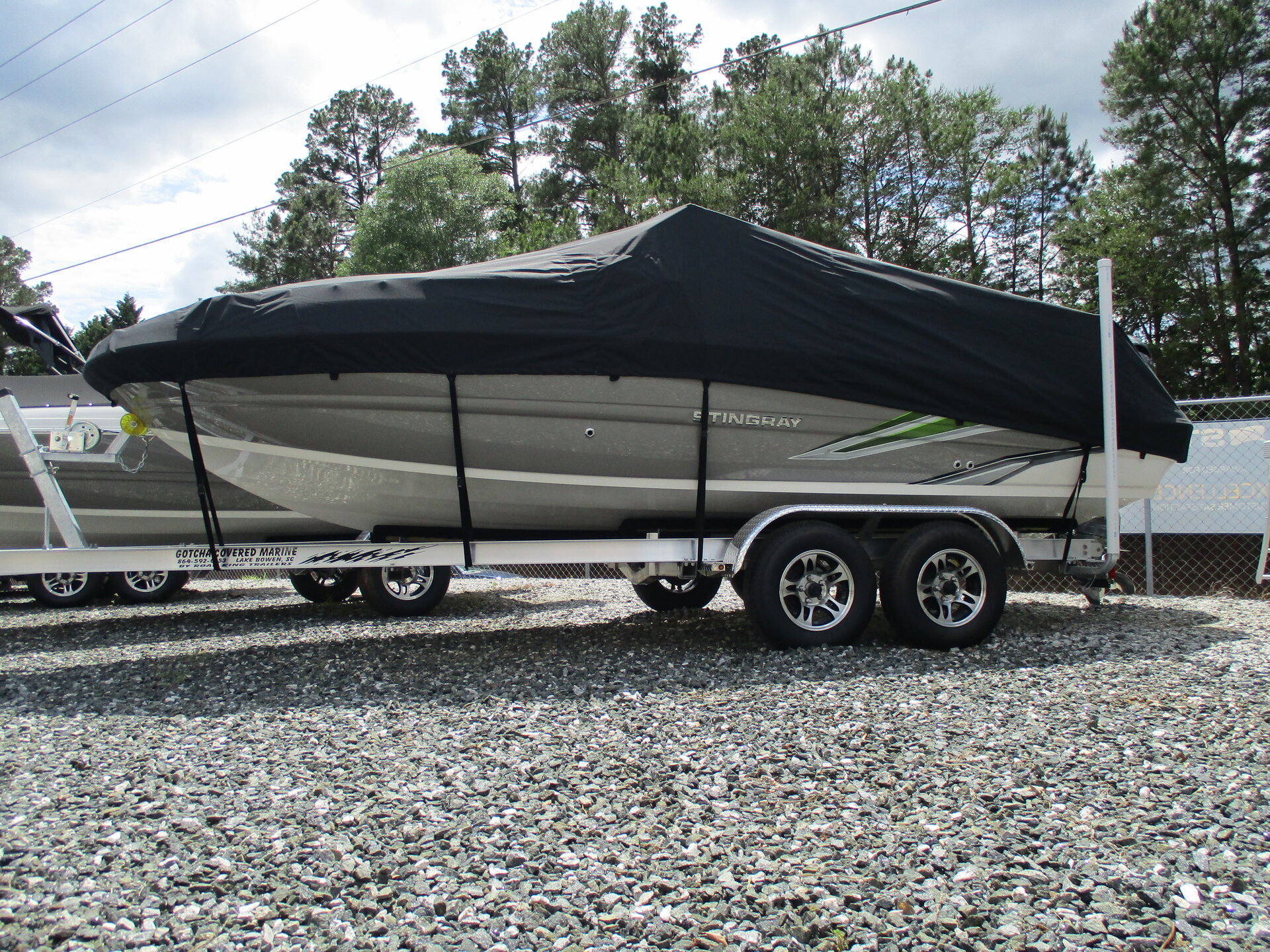 Custom-fit cover installed on Stingray 201DC Deck Boat Outboard