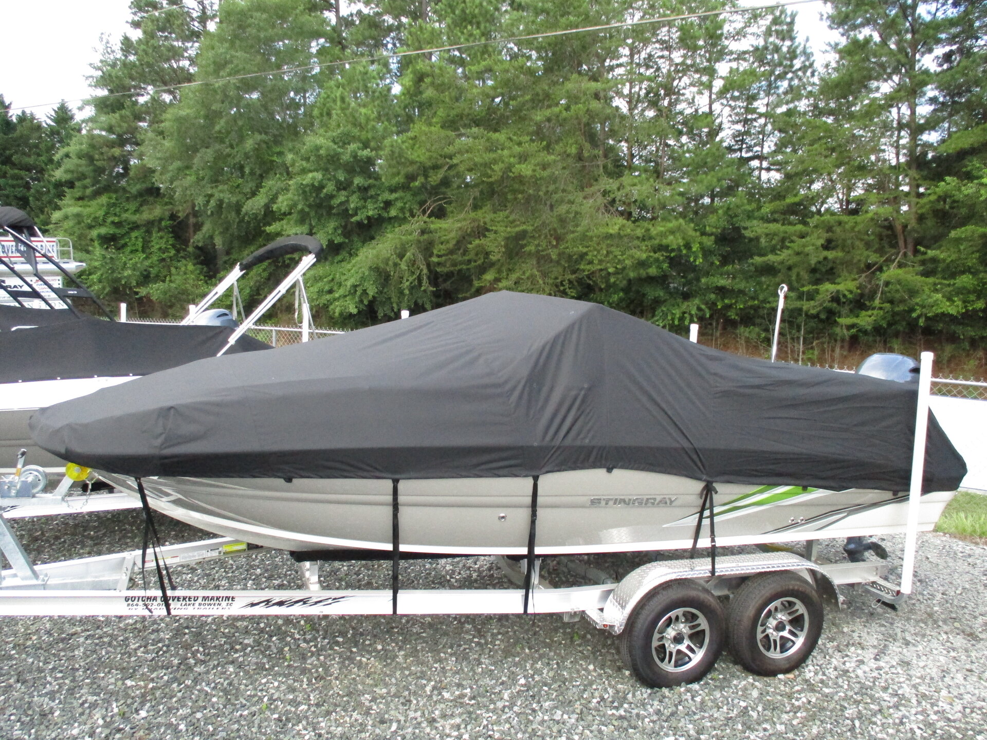 Custom-fit cover installed on Stingray 201DC Deck Boat Outboard