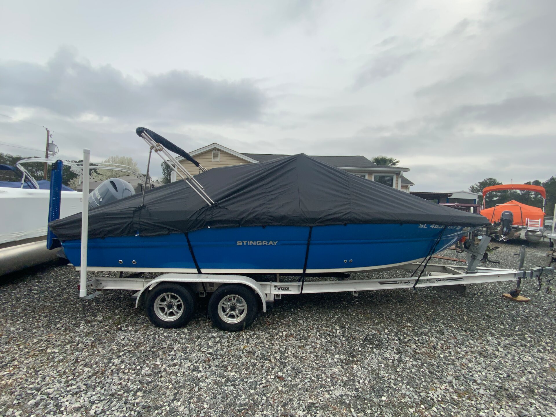Custom-fit cover installed on Stingray 236CC Deck Boat Outboard