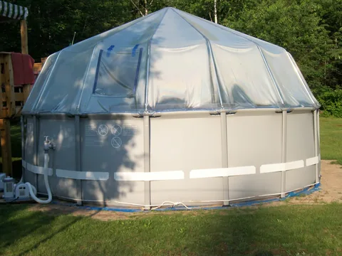 Fabrico vinyl dome mounted to the top rail of a round soft-sided pool