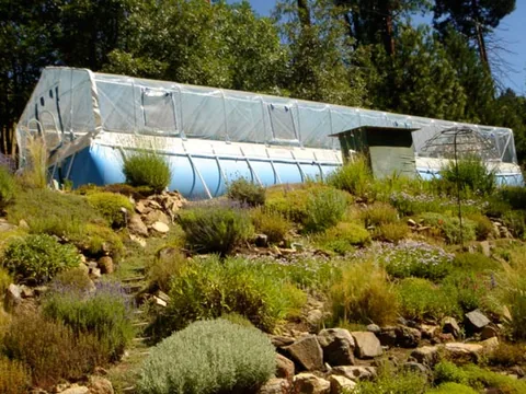 Clear vinyl Sun Dome over a rectangular soft-sided pool