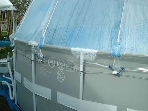 Cover tie-downs and mounting points along a soft-sided pool’s top rail