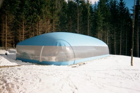 Blue residential Ameri-Dome surrounded by snow