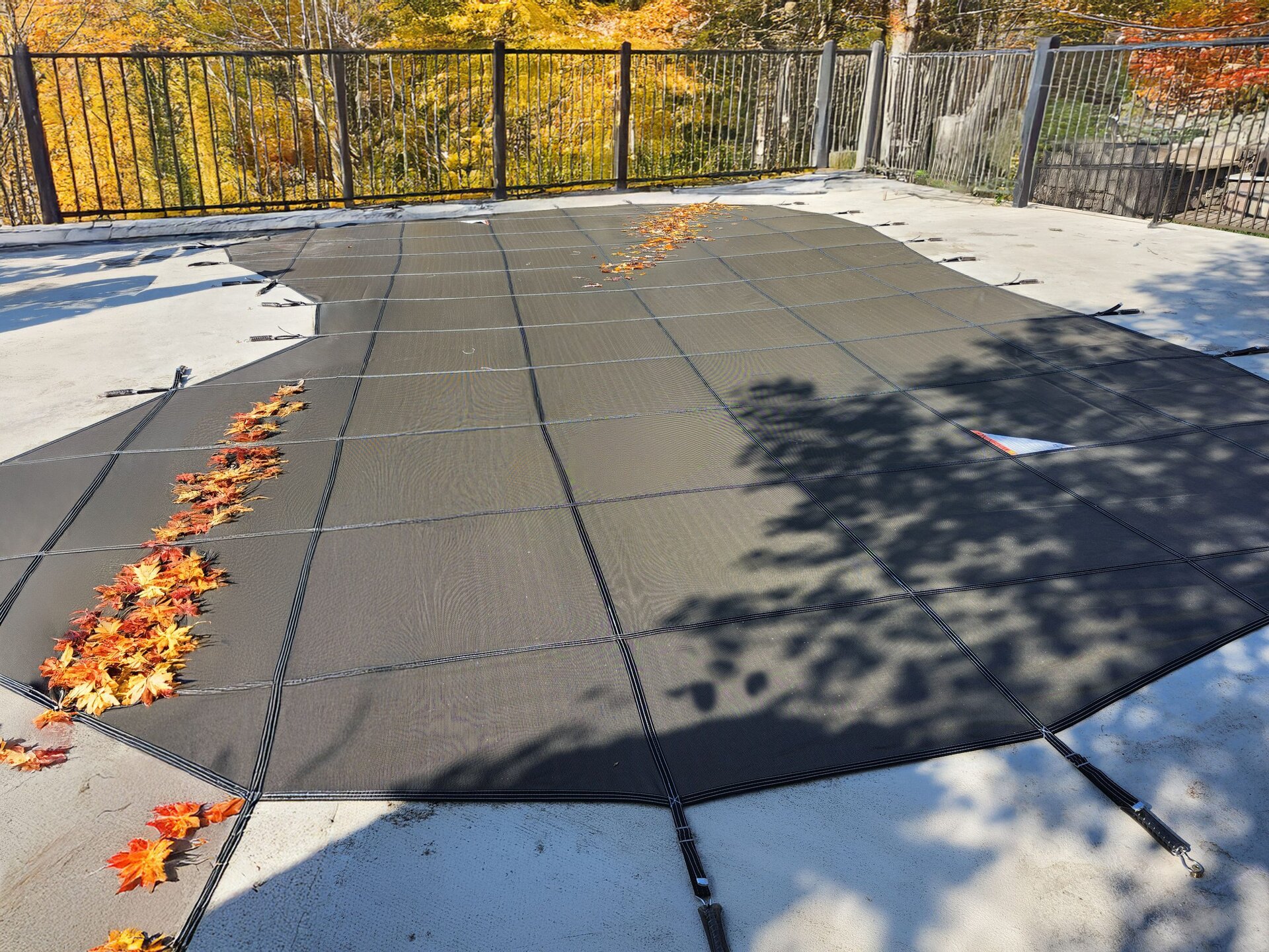 Meyco RuggedMesh safety cover showing its tight weave, reinforced seams and deck springs
