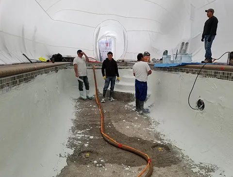 Crew working along the pool walls