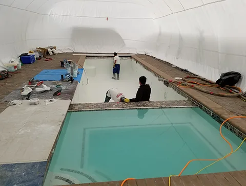 Protected work area around a pool and raised spa