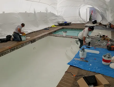 Pool renovation with equipment along the surrounding deck