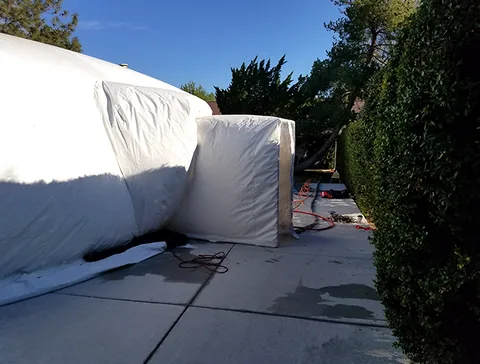 Airlock positioned along a paved walkway