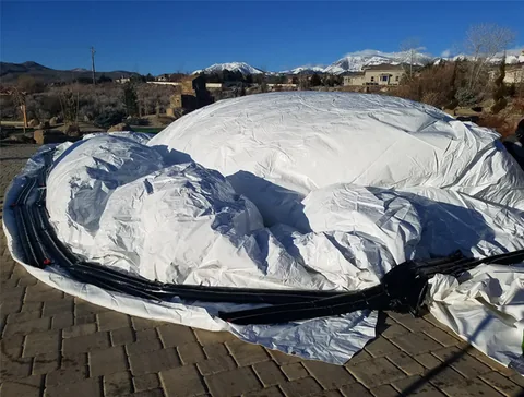 Water ballast positioned around the dome perimeter