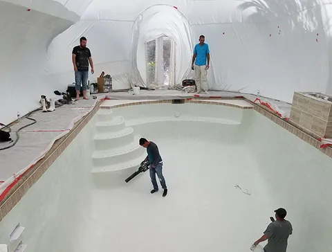 Crew working in the deep end of a pool