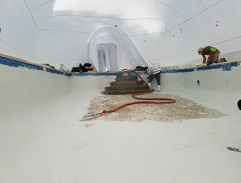 Work hoses across the pool floor