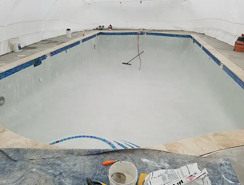 Pool interior and equipment beneath the enclosure