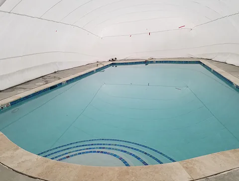 Water filling the pool beneath the dome