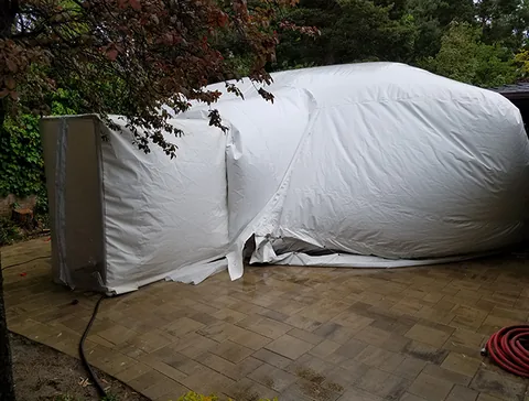 Construction dome beside landscaped planting beds