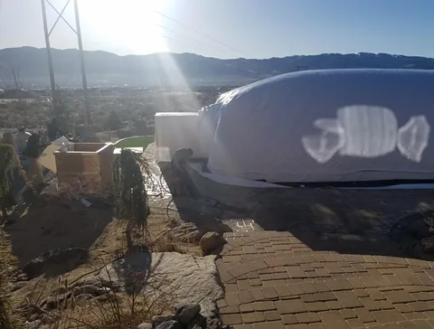 Side view of a construction dome at a job site