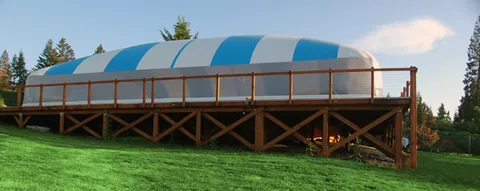 Side view of an Ameri-Dome over an above-ground pool