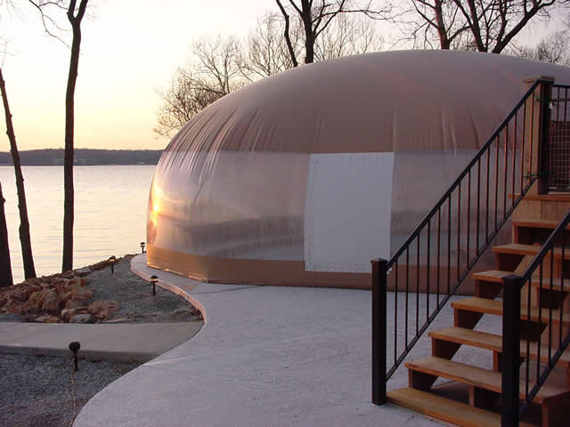 Ameri-Dome beside an elevated pool deck with a zippered entry panel