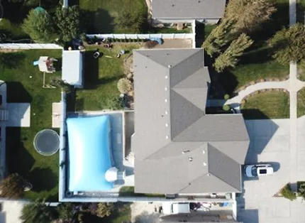 Overhead view of a pool dome and the surrounding property