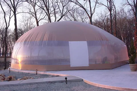 White pool dome with a zipper entry on a concrete deck
