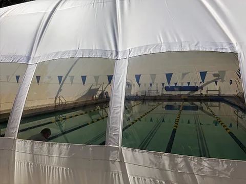 Lap lanes seen through a commercial pool dome viewing panel