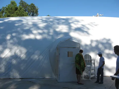 Entering the dome to re-attach deck hardware and pool accessories