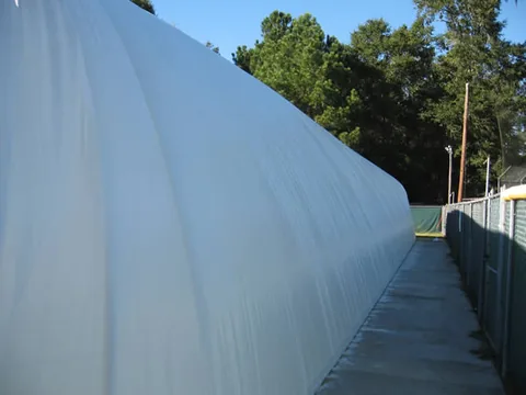 Long side of the dome, opposite the building and airlock entry system