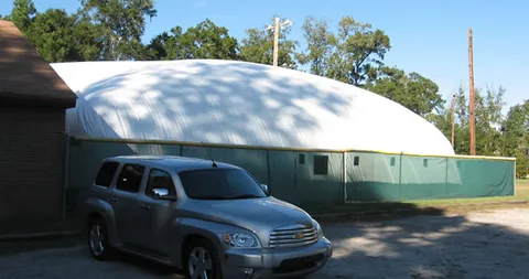 The fully inflated pool dome viewed from the parking lot