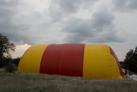 Exterior side view of the inflated red and yellow Sport Dome