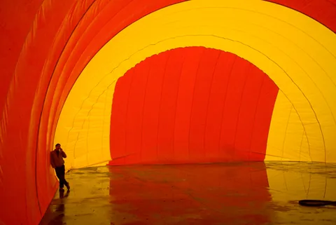 Person standing beside the sturdy inflated Sport Dome wall