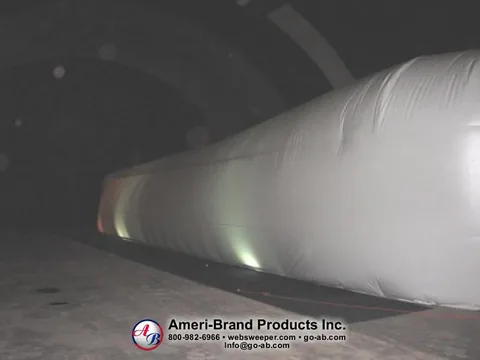 Full side view of a long white inflatable pitching dome