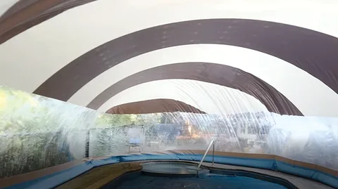 Brown and white striped pool dome interior