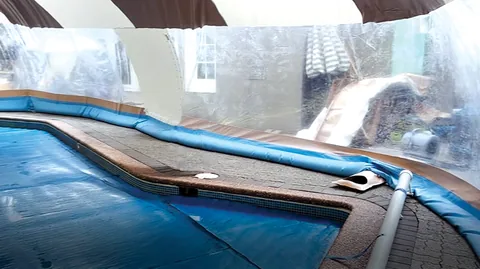Blue water-tube base following a curved pool edge