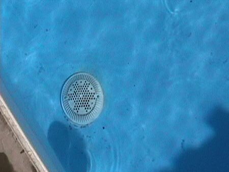 The bottom drain of the pool is cut into the liner so the easy draining capability is not lost.