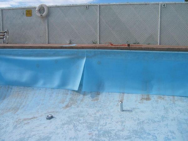 Pool ready for installation of wallfoam on sides and floor of pool. One quarter of inch thick, used for protection of liner.