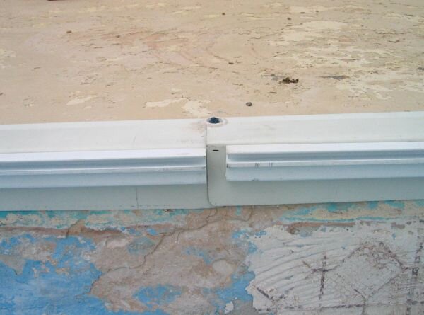 Two pieces of track to hang liner come together. Renovation kit provided by AmeriBrand Products.