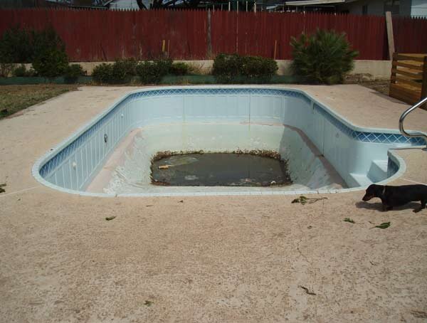 The endview of this Polynesian style pool shows that it clearly needs renovation.