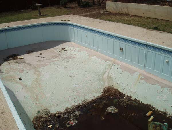 The shallow end shows the cracked water tight paint which was used in an attempt to seal the leak.