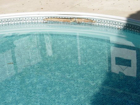 Vinyl-lined inground pool before repair