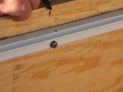 Fastener through the bead track
