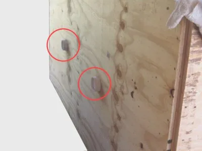 Marked fitting locations on the wooden wall