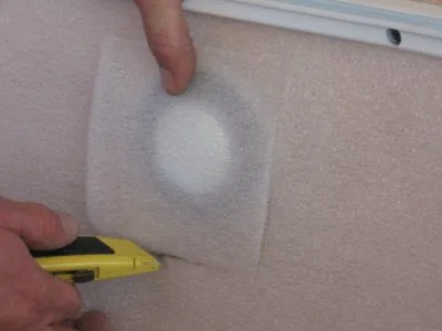 Trimming wall padding around the fitting