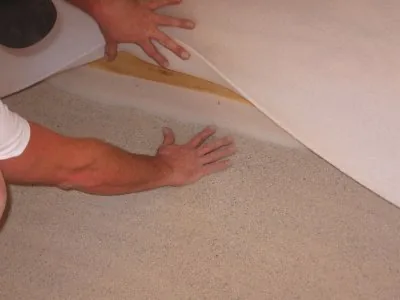 Positioning padding along the bottom of the wall