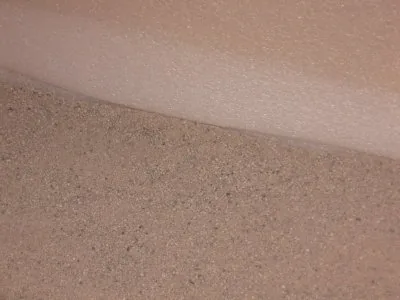 Prepared tank floor beside the padded wall