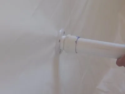 Support sleeve passing through the padded tank wall